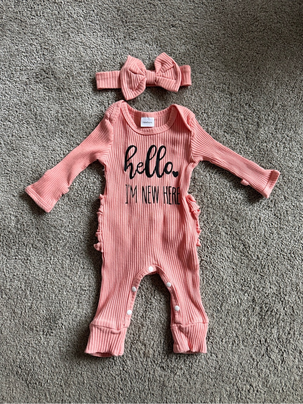 Hello I'm New Here Salmon colored Ribbed Baby One-Piece with Headband